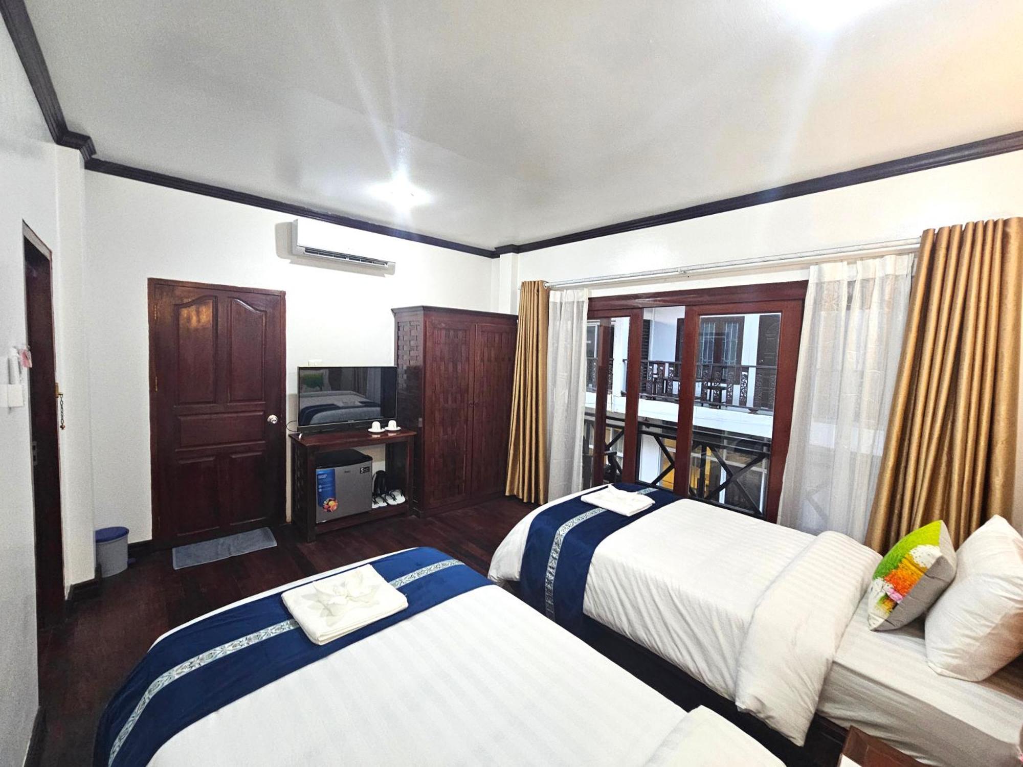 Win Hotel Vang Vieng Bagian luar foto