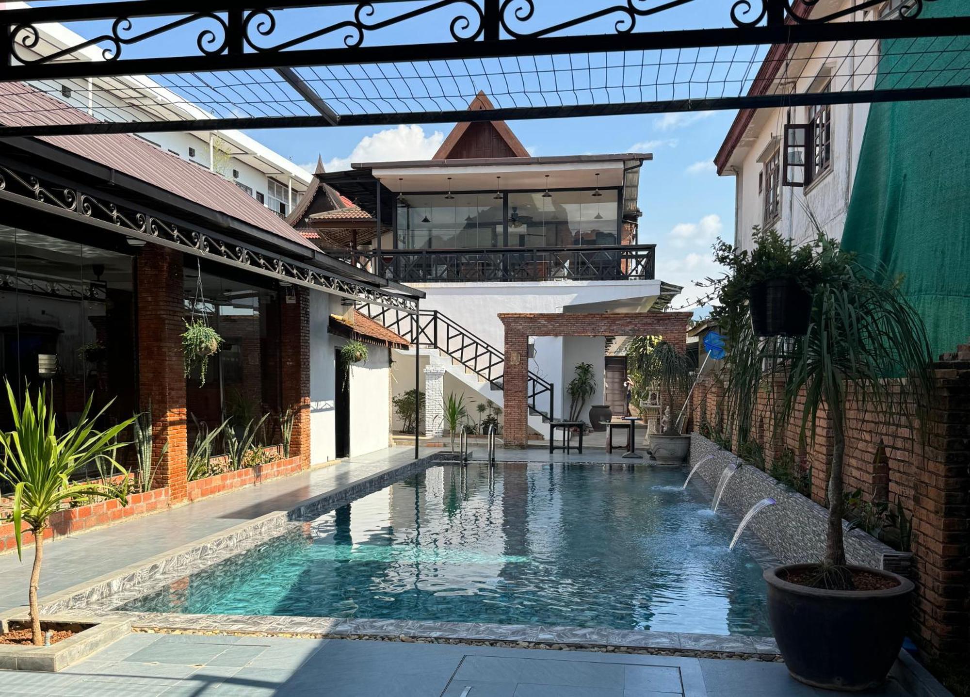Win Hotel Vang Vieng Bagian luar foto